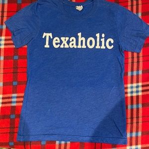 This is a kids Bella canvas small blue and white shirt that says texaholic#cute